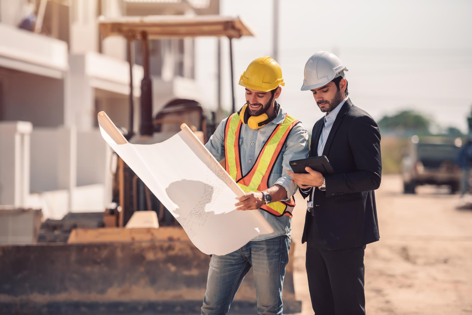 civil-engineer-construction-worker-manager-holding-digital-tablet-blueprints-talking-planing-about-construction-site-cooperation-teamwork-concept